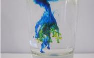 Brightly coloured chemical beginning to mix in water