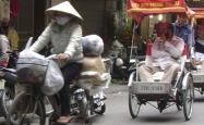 A photo of Asian rickshaws in a busy street